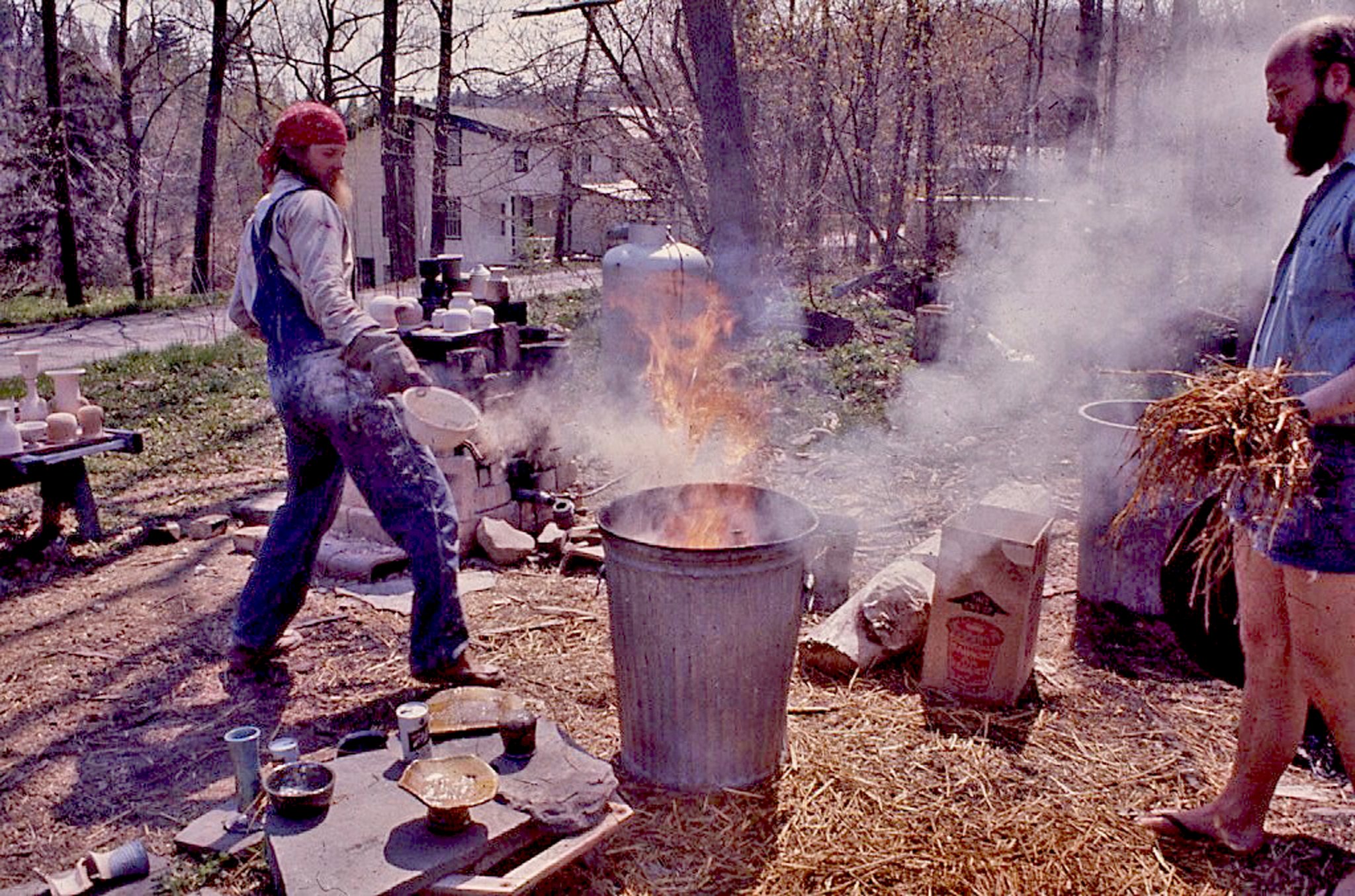 May be an image of 3 people and fire